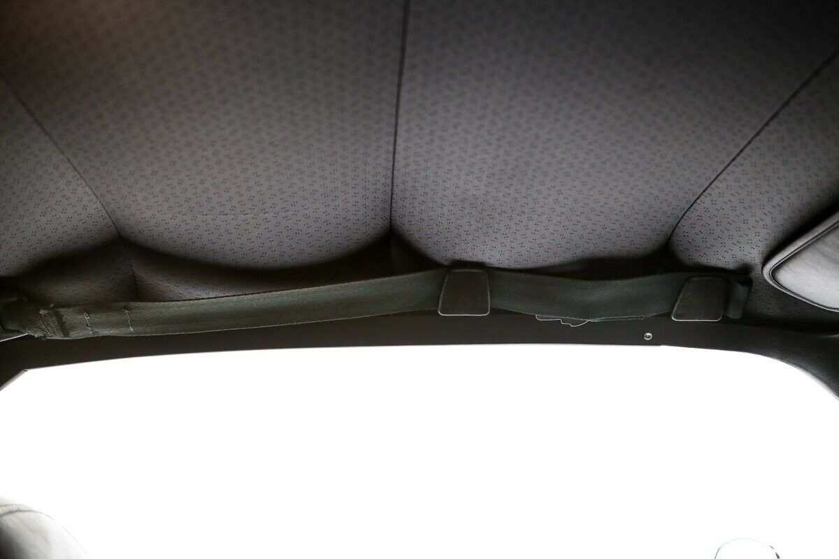 Shoulder Belts in Holder above Door.jpg